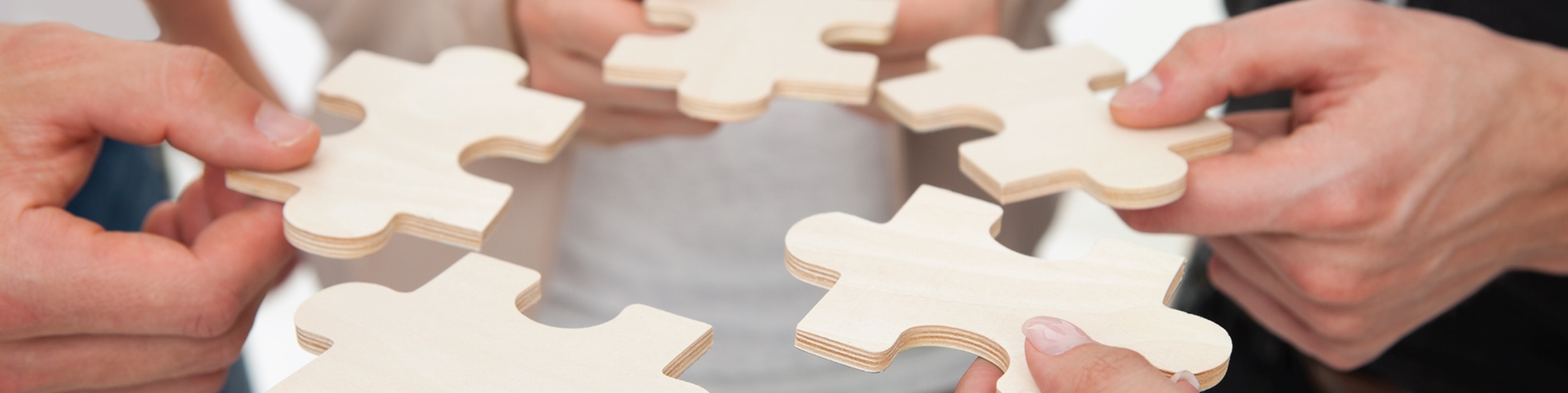 A group of individuals solving a puzzle together